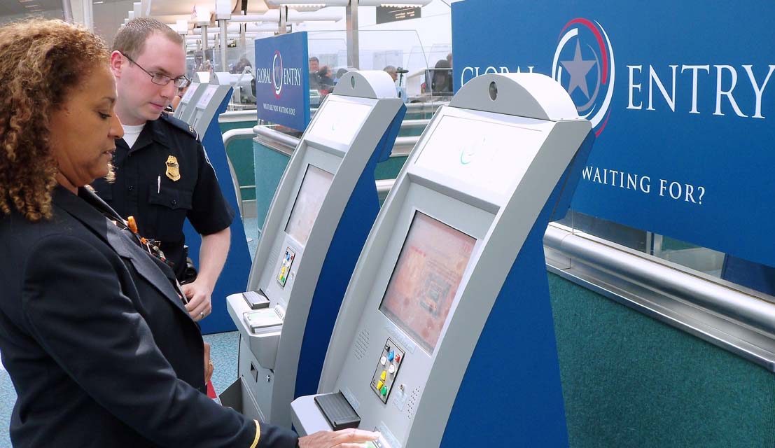 female going through global entry at airport