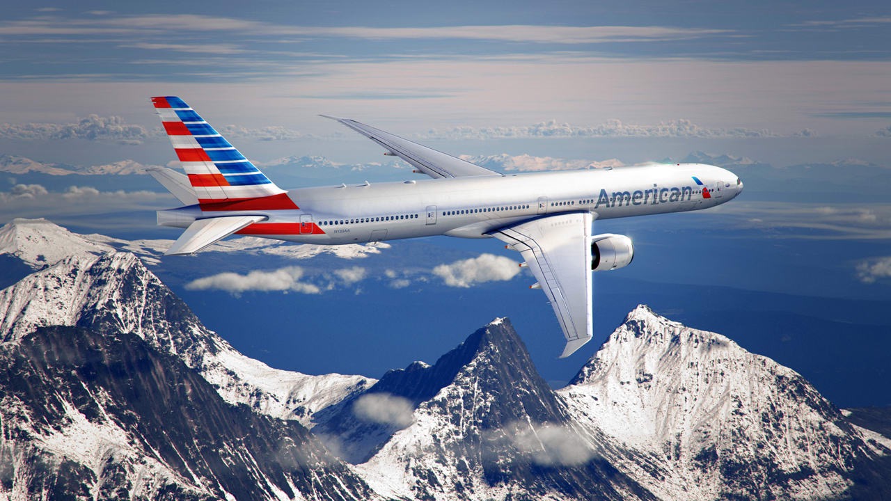 American Airlines plane flying over the mountains