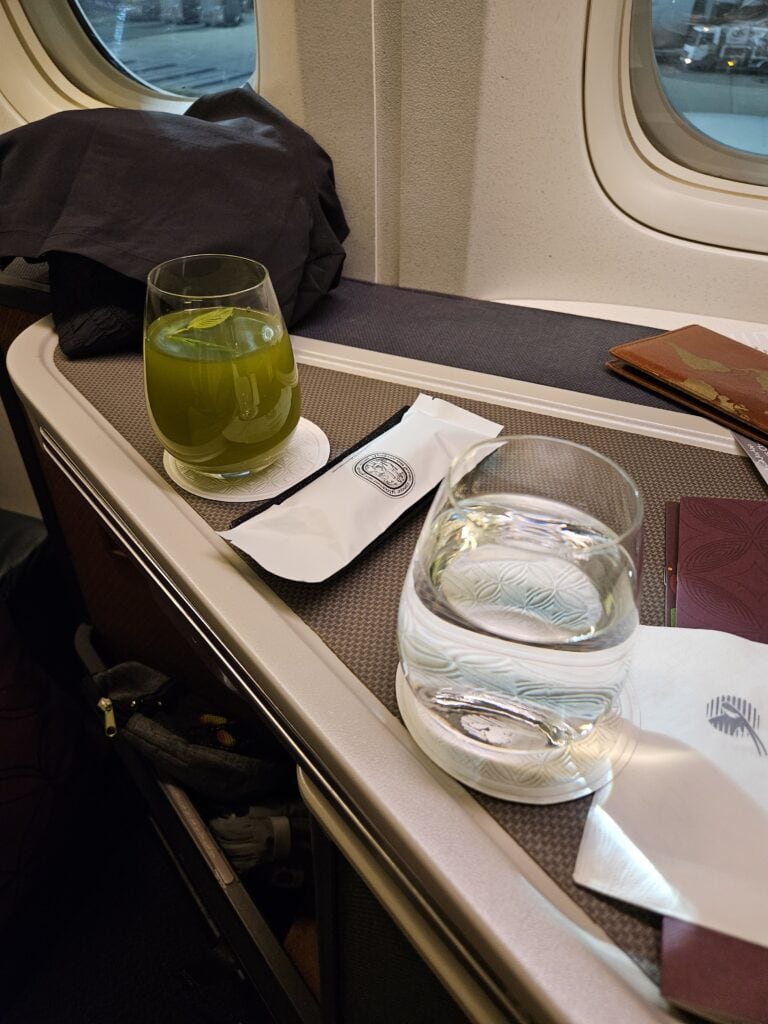 Qatar Airways 777-300ER Business Class Review – qatar airways 777 predeparture beverage.