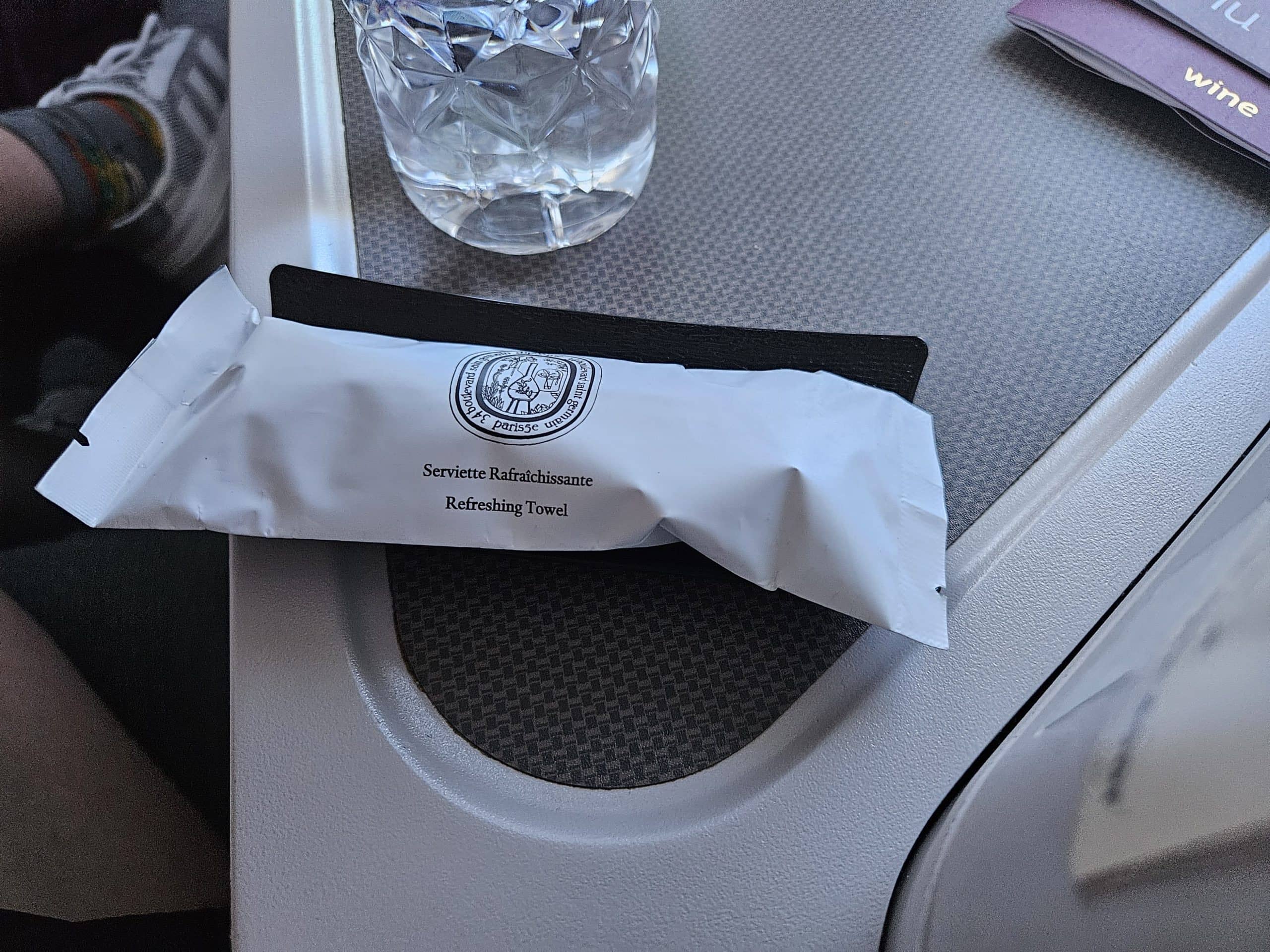Qatar Airways 777-300ER Business Class Review – qatar airways 777 refreshing towel and mint.