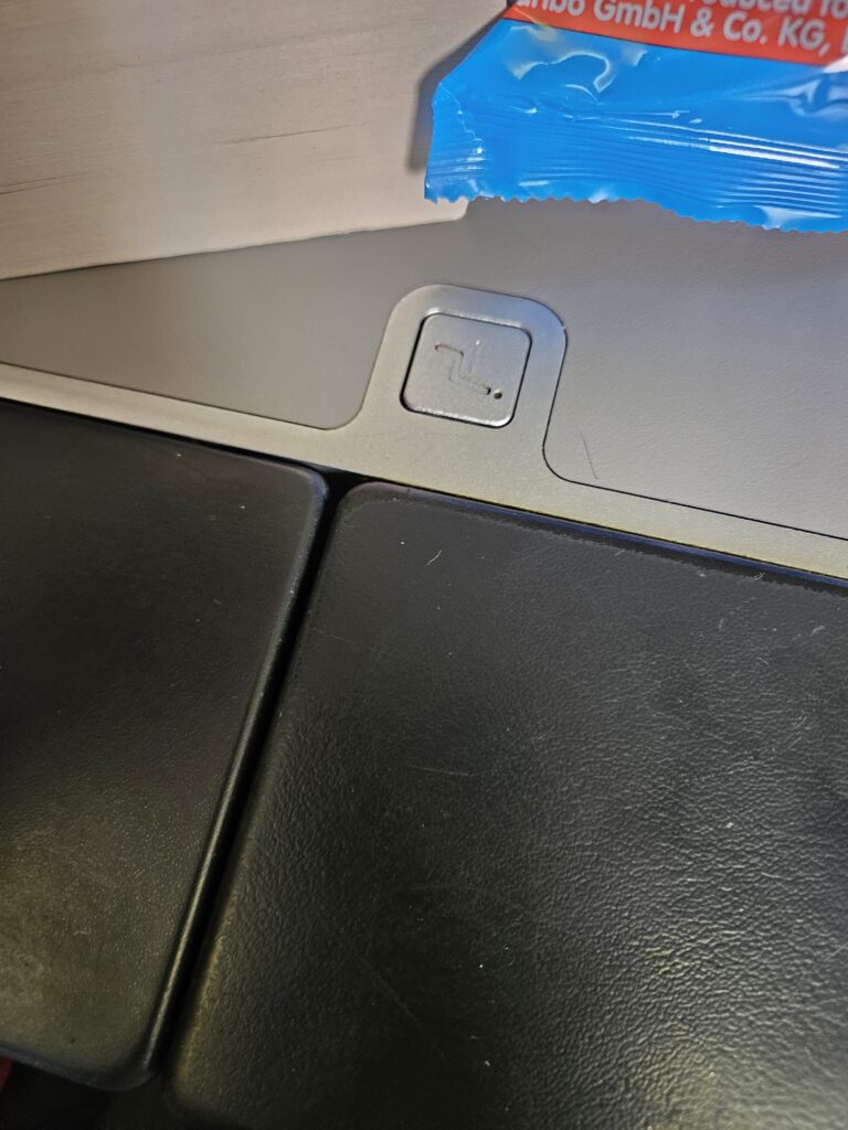 Austrian Airlines 767-300ER Business Class Review – press tray table disintegrating peeling away austrian airlines traytable
