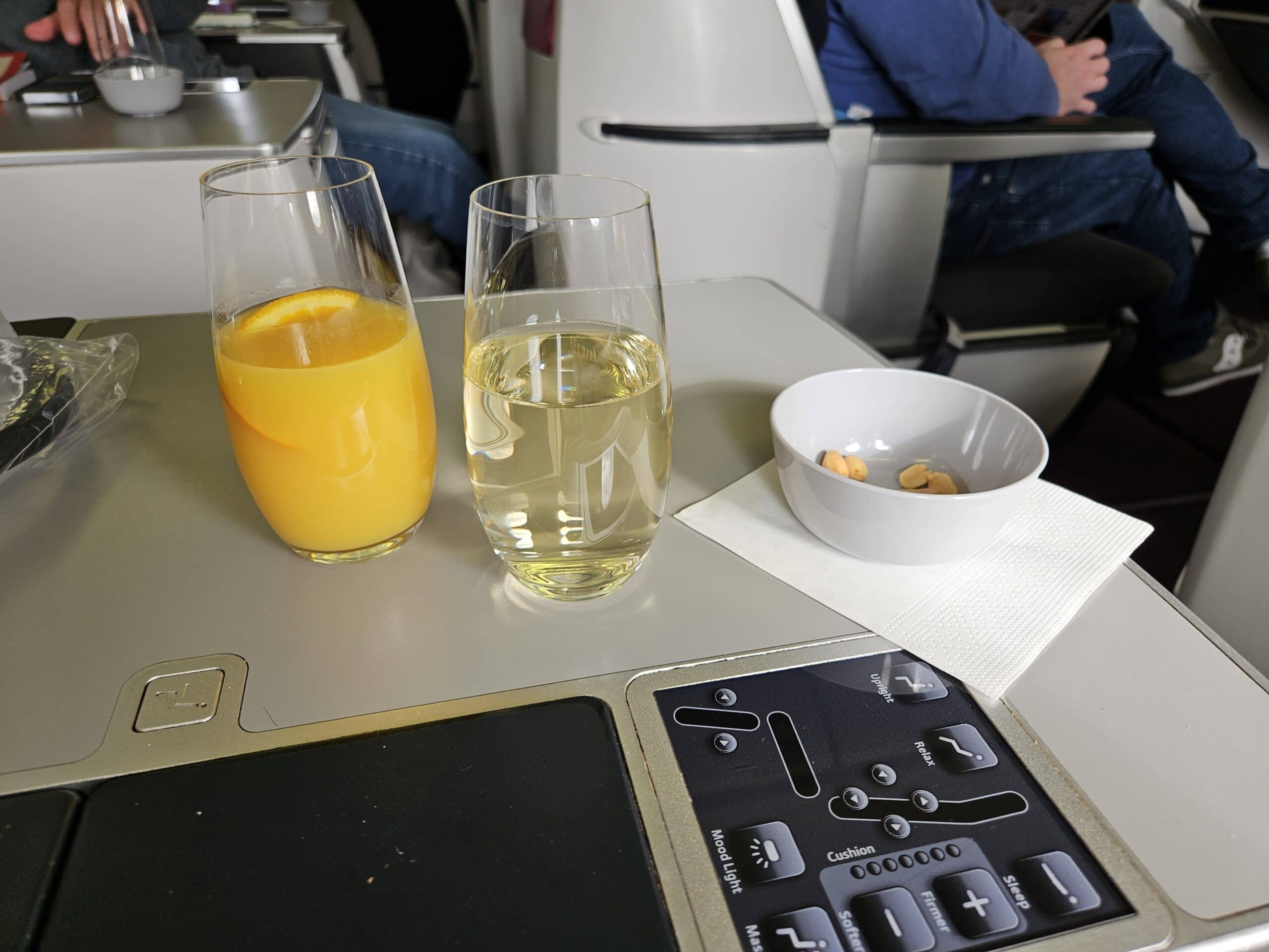 Austrian Airlines 767-300ER Business Class Review – orange juice sparkling wine champagne prosecco mixed nuts business class austrian airlines
