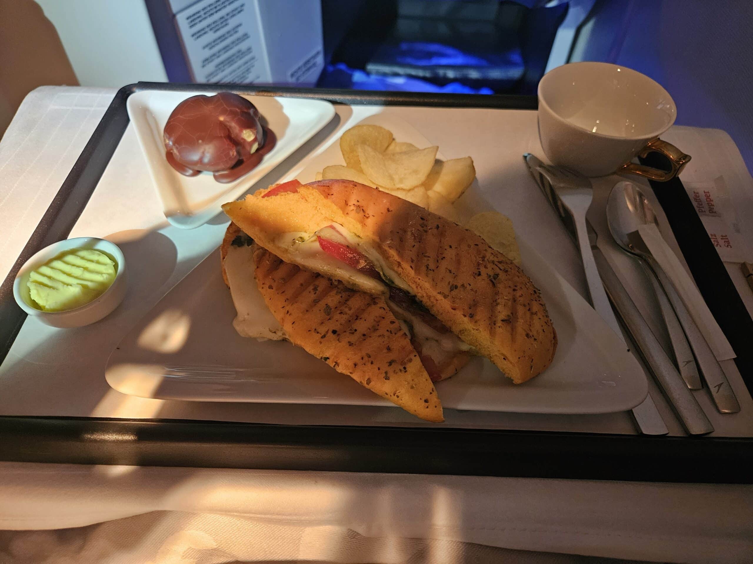 Austrian Airlines 767-300ER Business Class Review – business class austrian airlines end of flight panini chips dessert coffee coffee cup