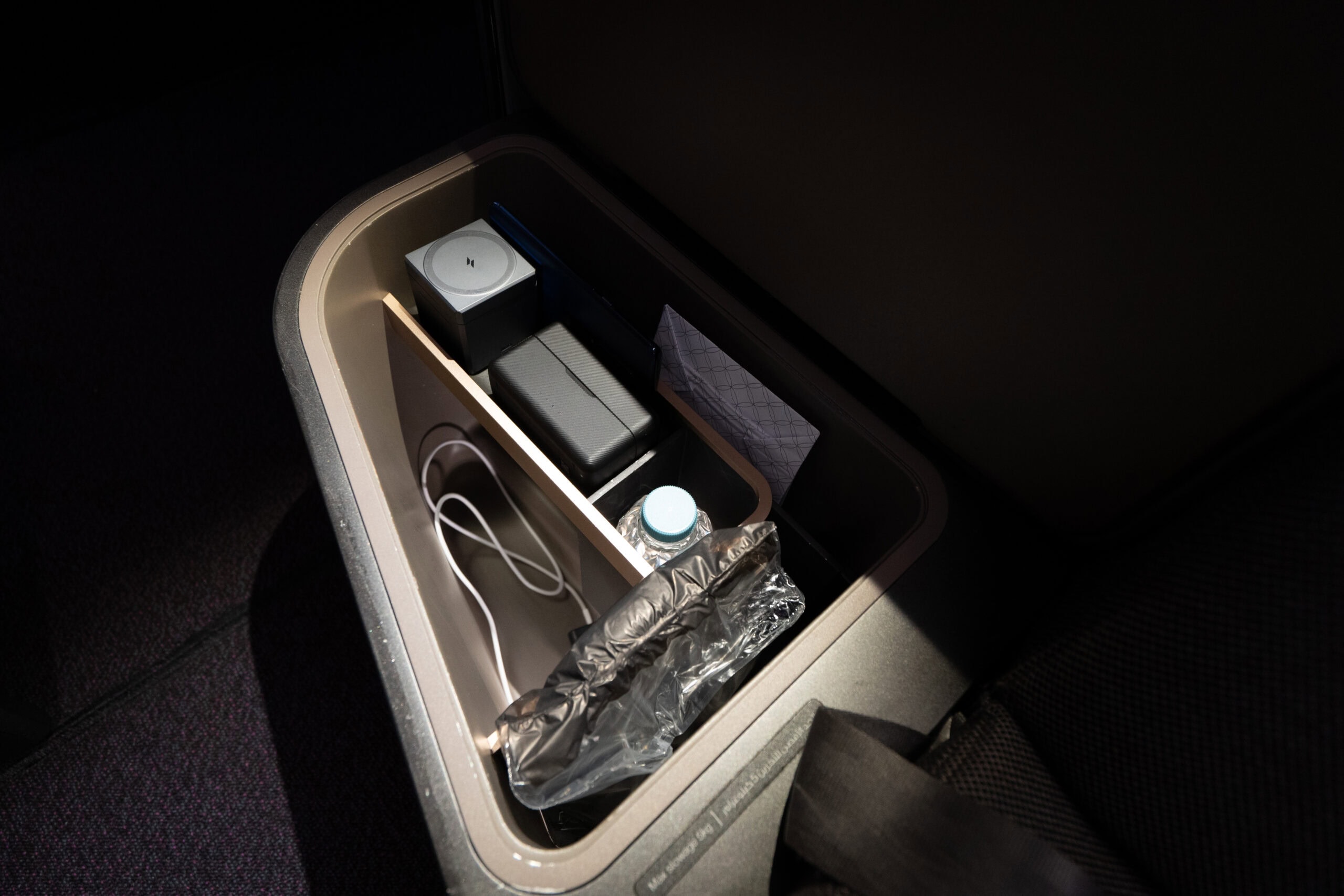 Qatar Airways 777-300ER Business Class [Qsuite] - Seat Storage